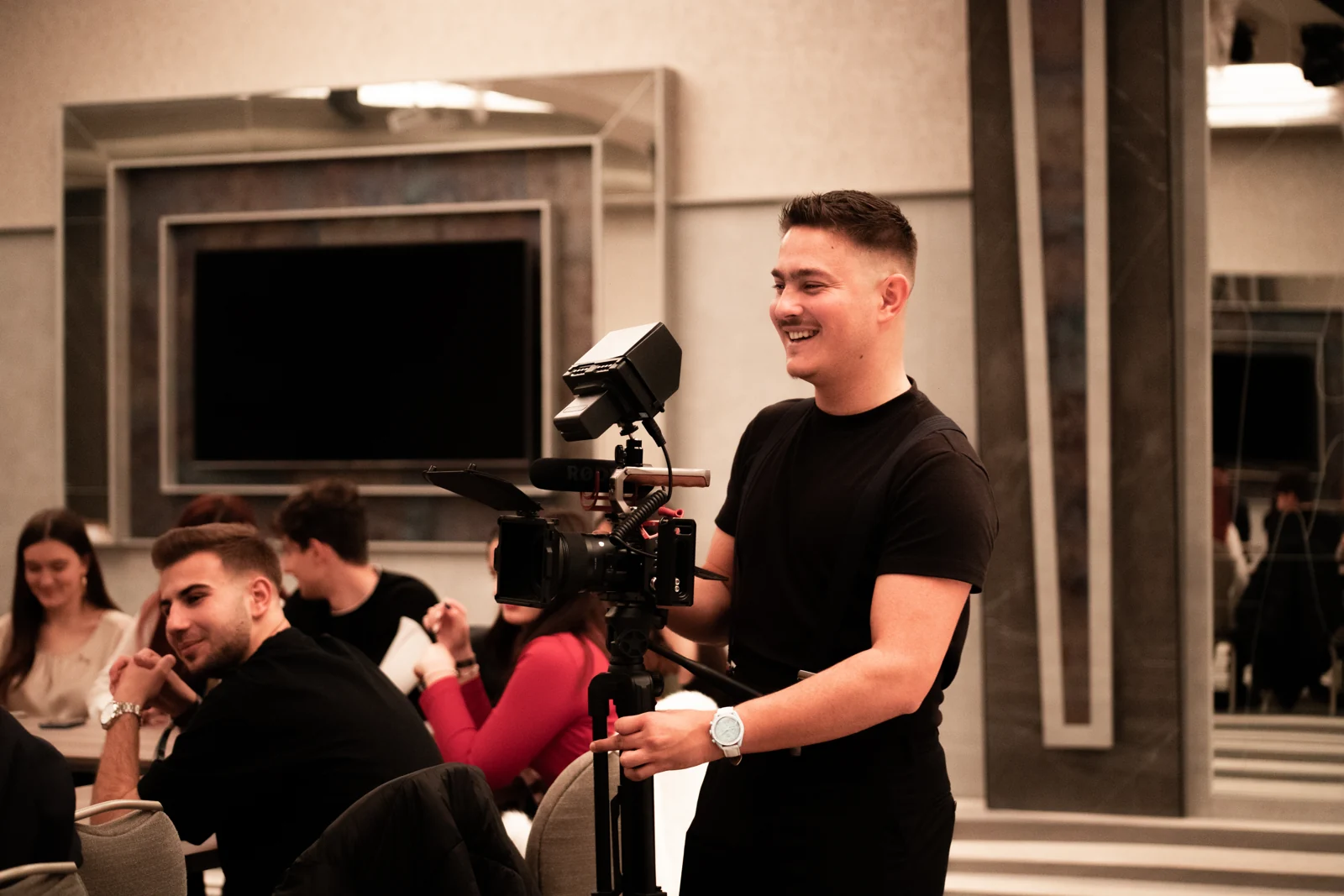 Camera operator filming a live event