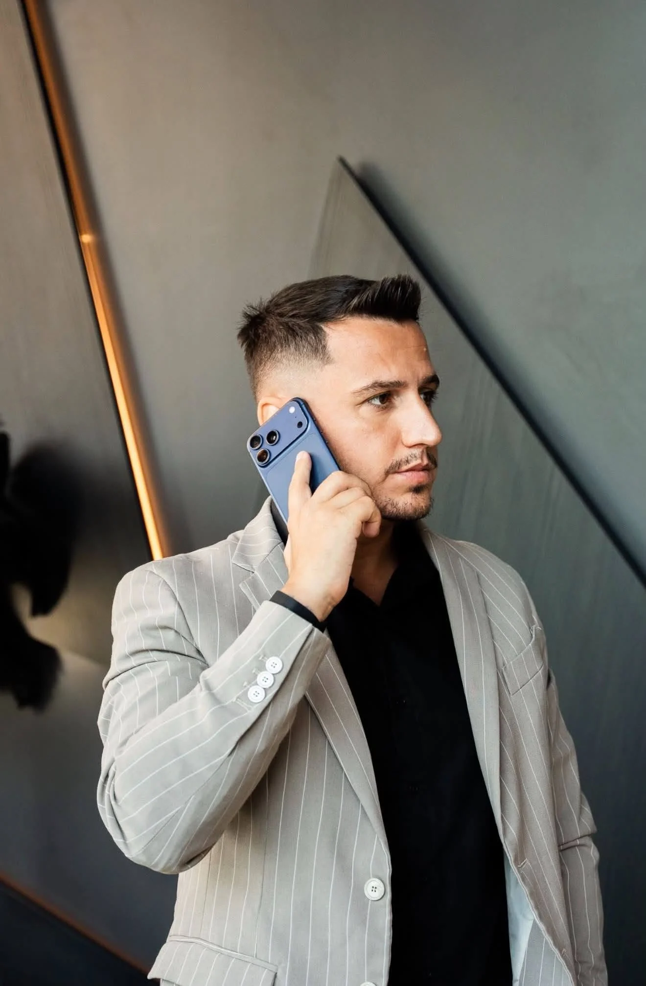 Portrait of Cosmin Radoi looking ahead while on a call